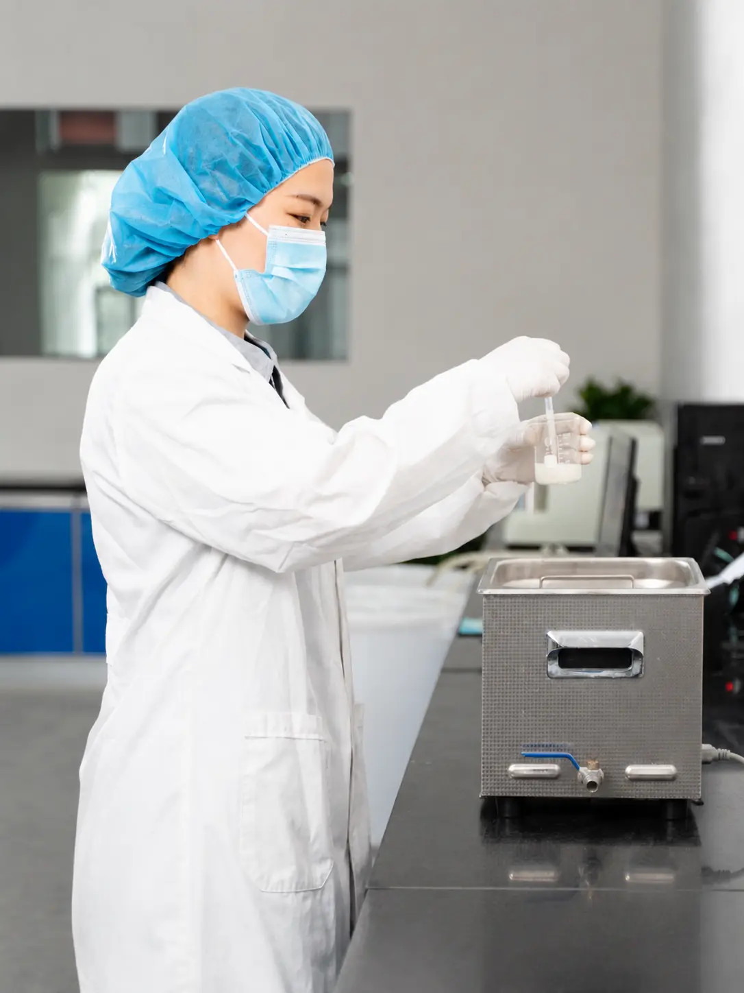 Laboratory technician preparing a diamond powder sample for quality control testing